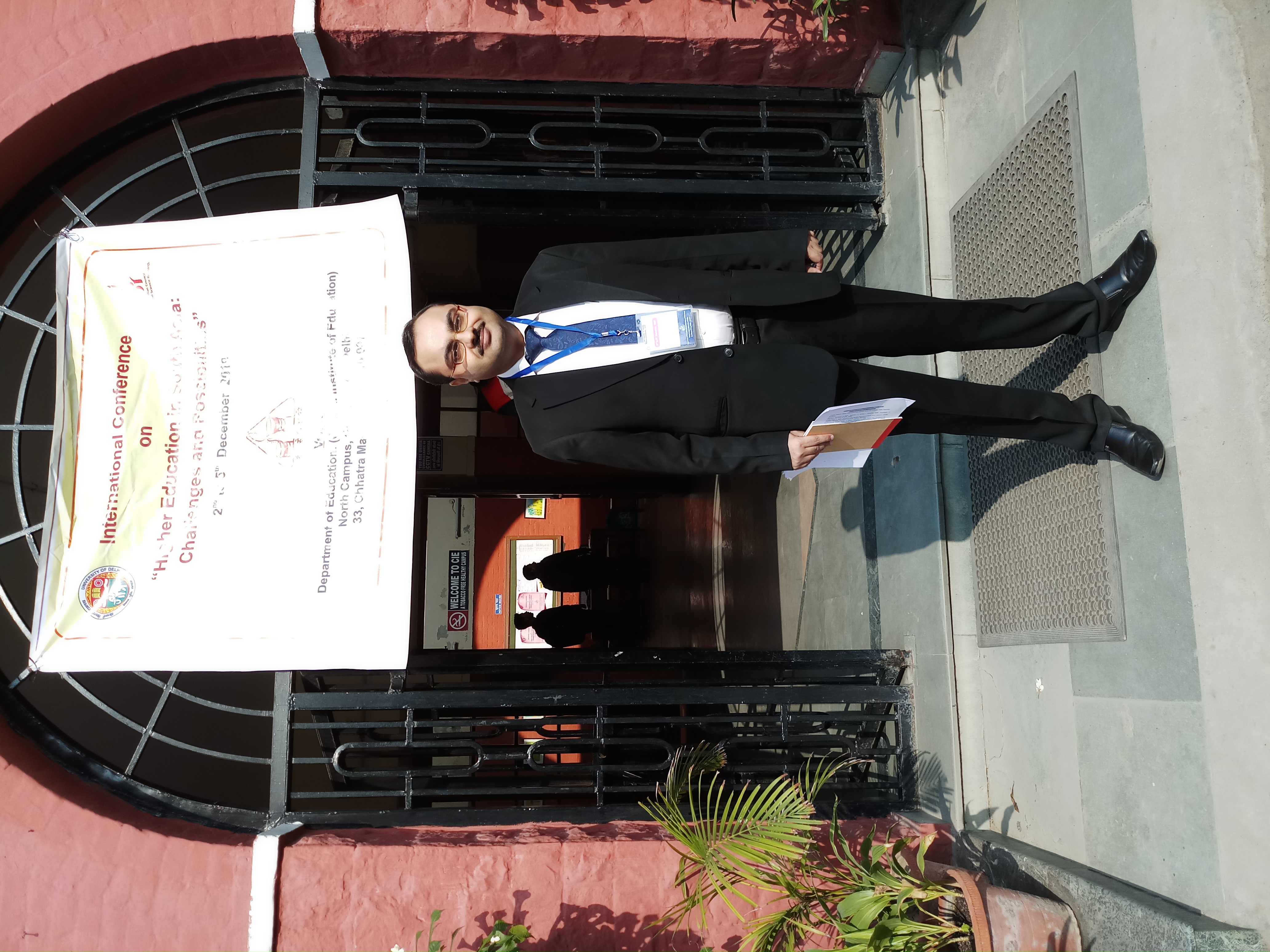 Presenting a paper on educational software at a conference held at the University of Delhi.